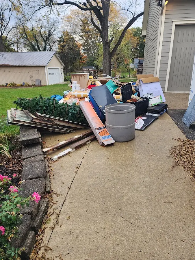 Dumpster being loaded with debris for 30 Yard Dumpster Rental in Unadilla